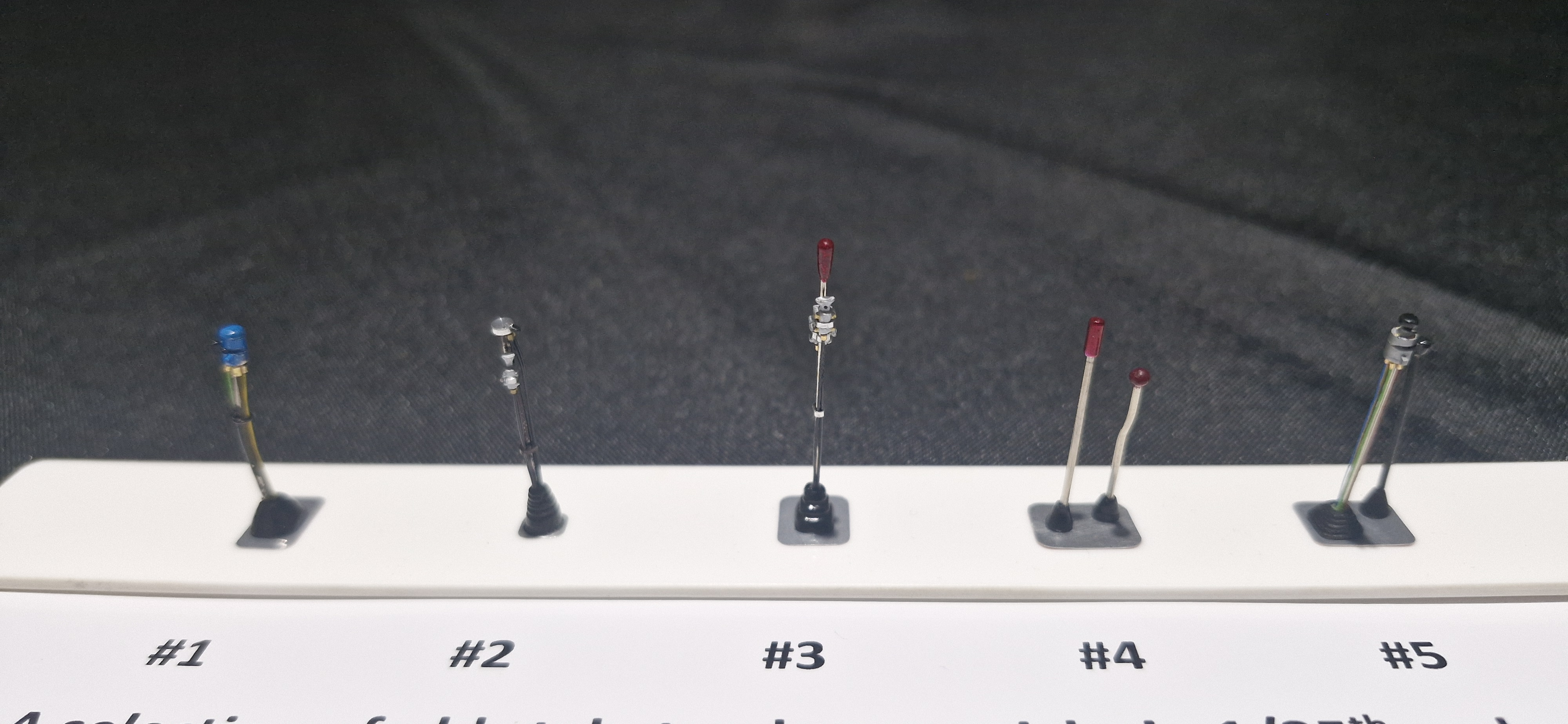 A selection of 5 various old school truck gear sticks 